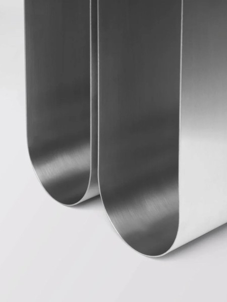 Kristina Dam Curved side table in raw steel Curved